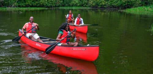 Family canoeing on Price Lake in Blowing Rock, NC