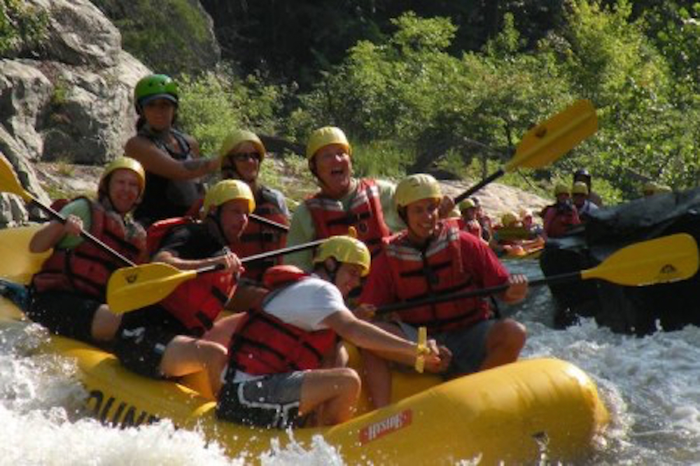 group of people whitewater rafting