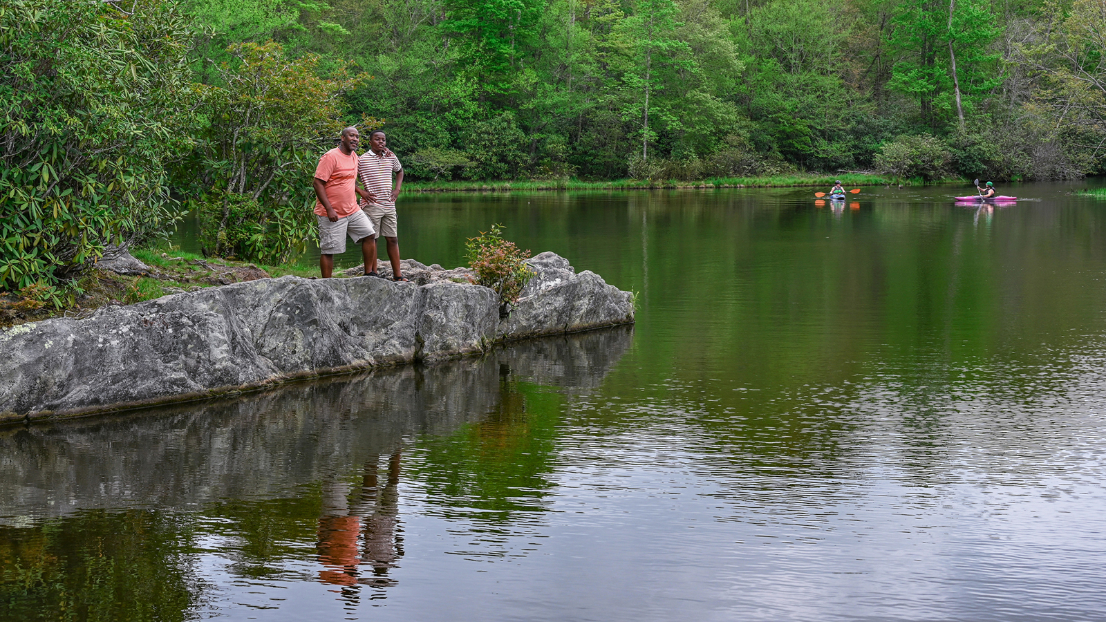 teenagers kayaking on price lake