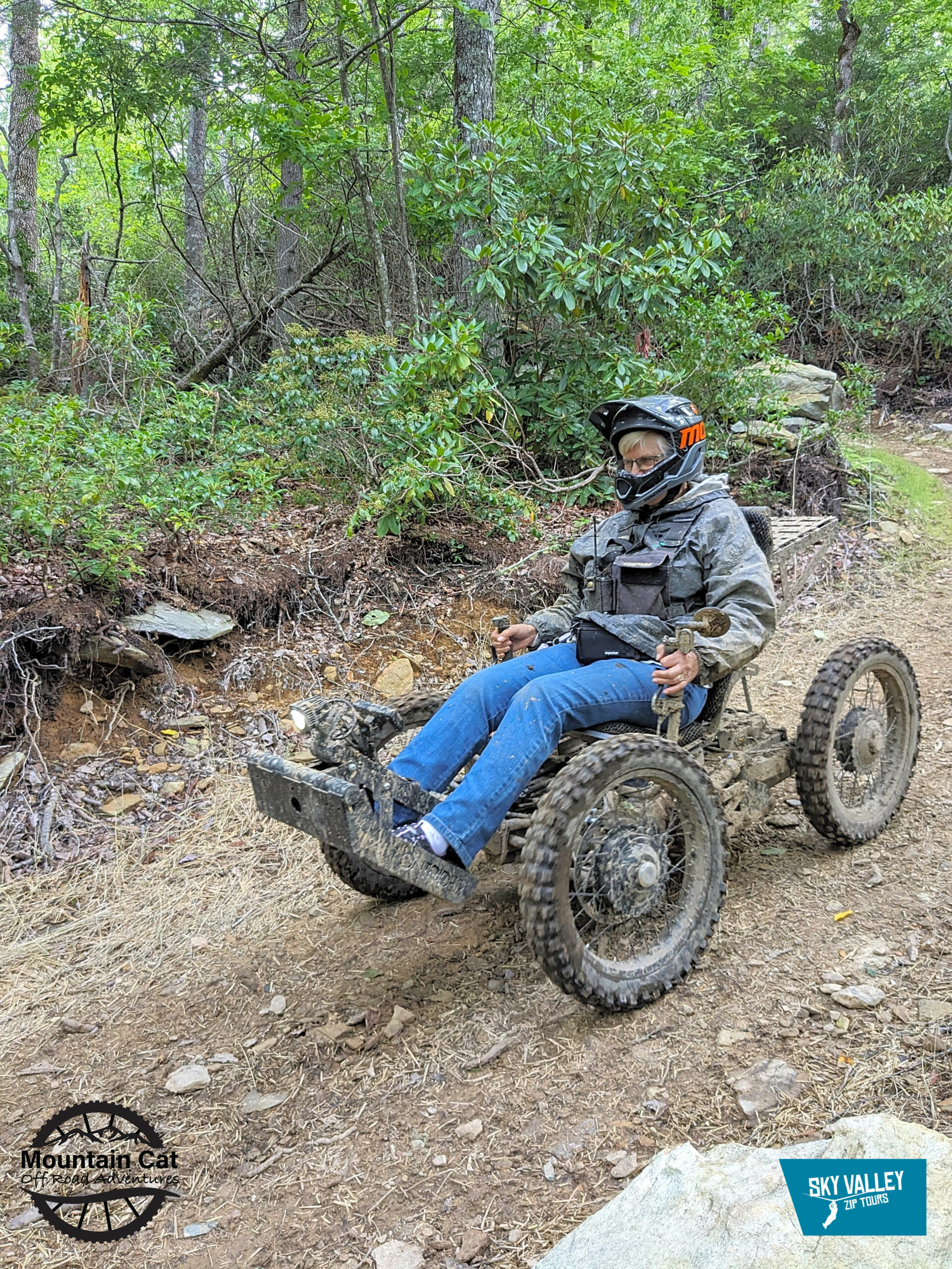 Person riding an accessible electric trail vehicle at Sky Valley Zip Tours