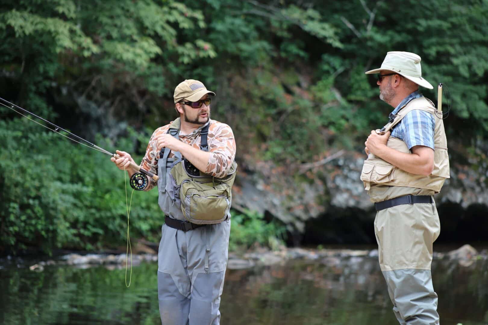 fly-fishing guide with angler in river