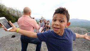 young boy at the blowing rock for family adventure