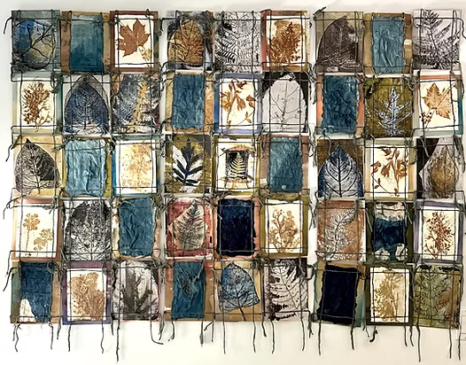 A mixed media wall hanging piece by Wen Redmond.