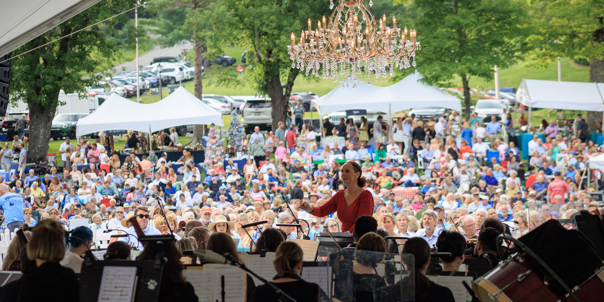 Symphony on the Mountain 2025 with crowd and symphony in foreground.