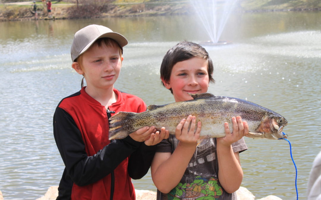 kids with trophy trout