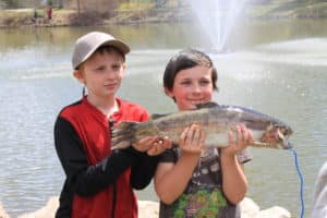 kids with trophy trout