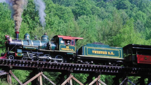 Blowing Rock attractions include Tweetsie Railroad, pictured here as a train over a trestle